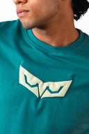 Sollzz Abyss : Inner Descent Oversize Tee in muted teal, close-up shot of the chest displaying the light cream high-density heavy puff print graphic logo
