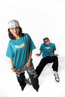 Sollzz Abyss : Inner Descent Oversize Tee flat lay product back view in muted teal featuring a large framed cream decaying portal back graphic with distorted organic forms